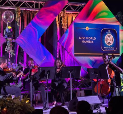 Creative stage production for Miss World Namibia featuring a string quartet performing in front of custom-shaped geometric LED video displays.